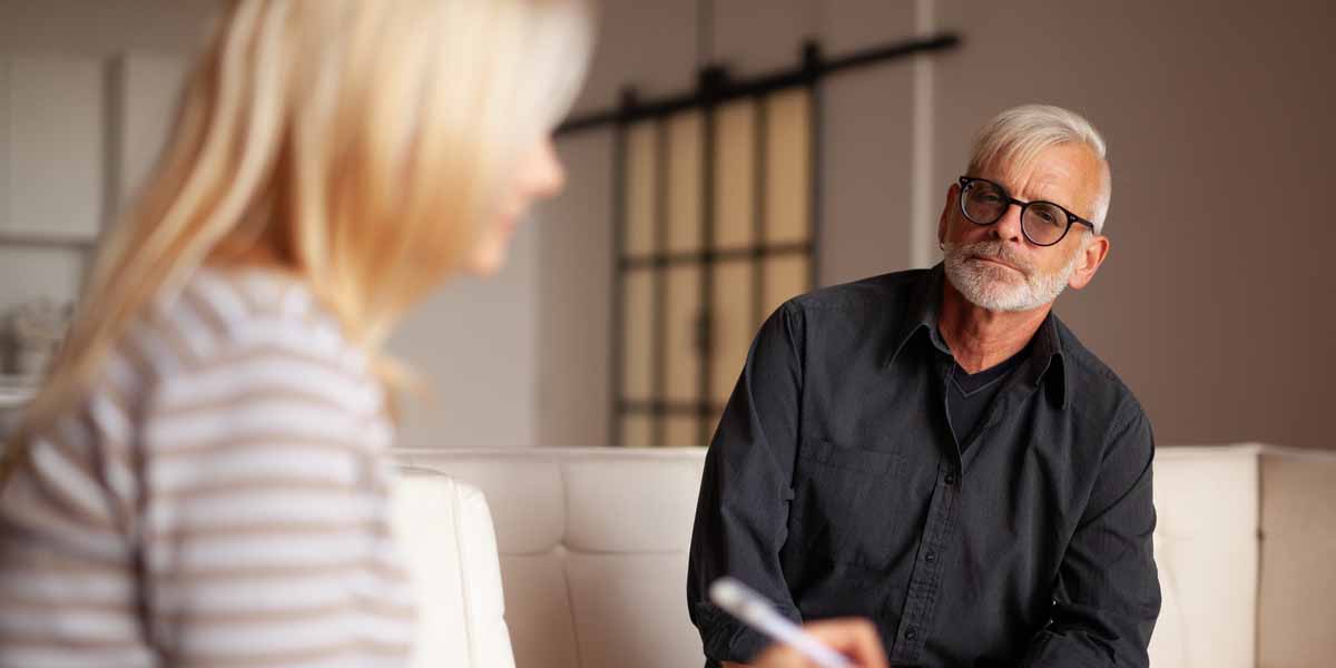 older man getting therapy for bipolar disorder