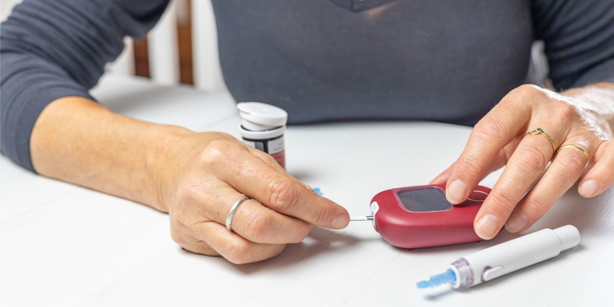 hands using glucose testing for diabetes
