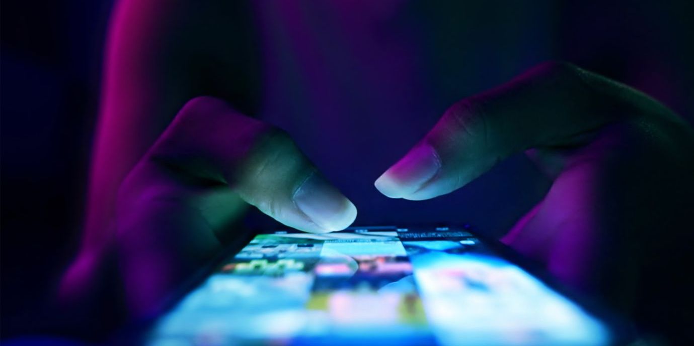 typing social media posts on a phone